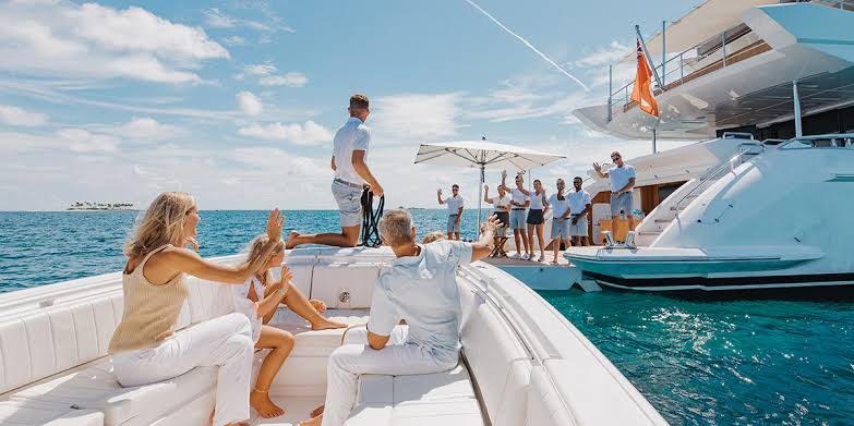 Guests welcomed aboard a charter yacht